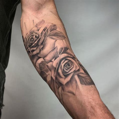 Black And Grey Roses Tattoo On The Inner Forearm
