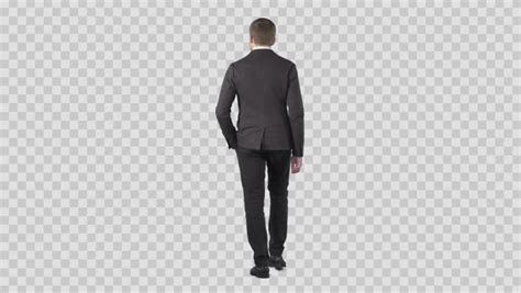 Business Man In Gray Suit Walking From The Camera Lens 85 Mm Camera