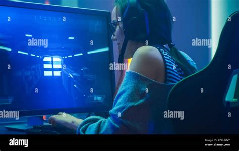 Shot Of The Beautiful Pro Gamer Girl Playing In Fps Video Game On Her
