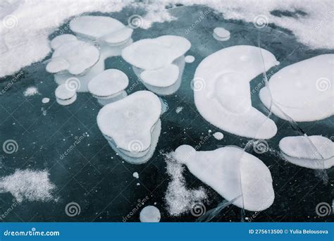 Gas Methane Bubbles Frozen In Blue Ice Of Lake Baikal Stock Photo