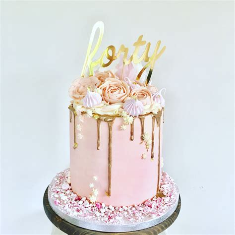 Pink Buttercream Cake With Buttercream Flowers Including Roses And