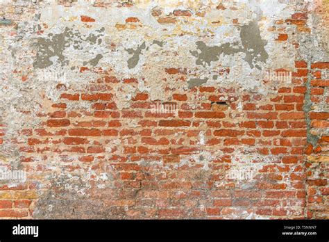 Old Brick Wall Texture Covered With Multiply Stucco Plaster And Paint