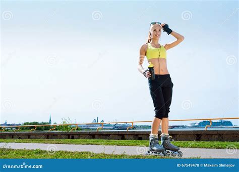 Young Beautiful Sporty And Fit Girl Rollerblading Stock Photo Image