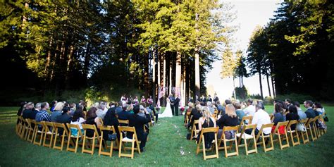 There is a barn with chandeliers and a backyard with trees for the ceremony. Mountain Terrace Weddings | Get Prices for Wedding Venues ...