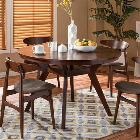 Round dining table top have elegant design and modern look. Baxton Studio Flamingo Mid-Century Dining Table & Chair 5 ...