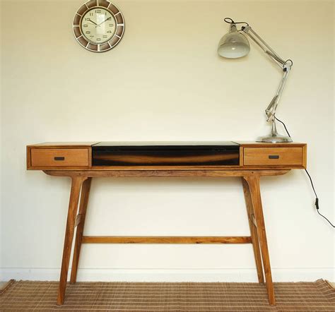 Contrasting wood patterns make this a striking piece. mid century style teak desk by cambrewood ...