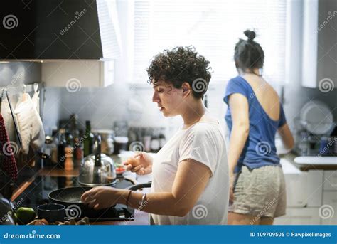 Lesbian Couple Cooking In The Kitchen Together Stock Photo Image Of Dinner Celebrating