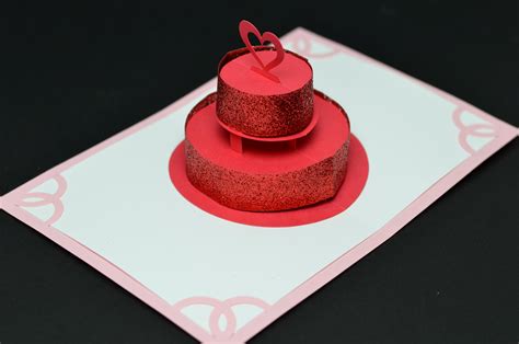Making sure that the writing is on the outside. Sparkly Red Lover's Cake Pop-Up Card - Creative Pop Up Cards