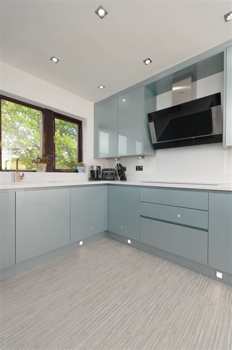 Our handleless kitchen design in white high gloss lacquer with bespoke oak winerack. The doors are a handleless Verve door from M&J Designs in ...