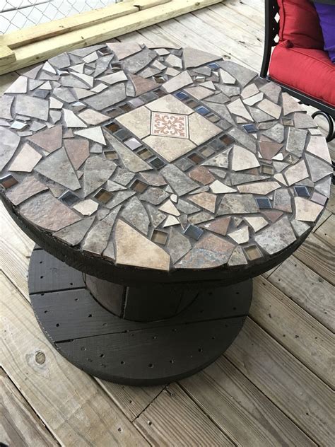 Rosecliff heights connerton wooden picnic table. Wooden spool with stone mosaic top for a patio table. Cool ...