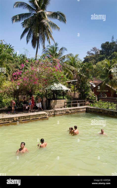 indonesia bali banjar air panas volcanic hot spring people bathing in holy swimming pool
