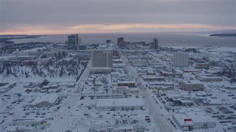 4k Aerial Video Flying Over Snow Covered Downtown Anchorage At Twilight