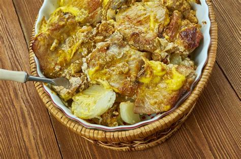 Arrange the browned chops on top. Pork Chops Scalloped Potatoes Casserole Stock Photo ...