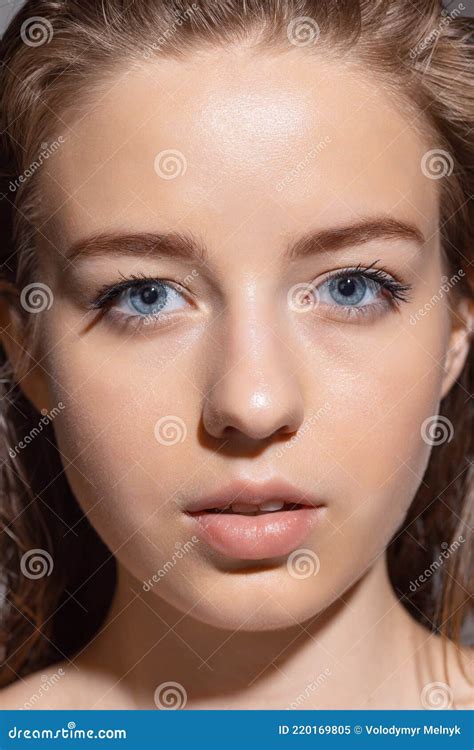 Close Up Young Beautiful Girl Posing Isolated On Grey Studio Background