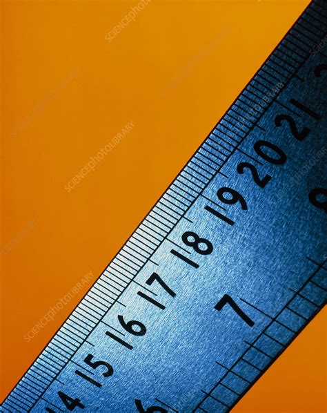 Steel ruler with inch and centimetre graduations - Stock Image H305/0120 - Science Photo Library
