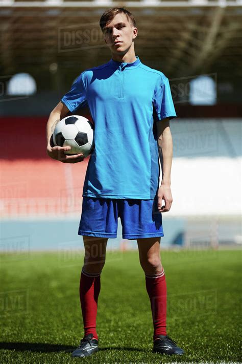 Young Soccer Player Holding Soccer Ball Stock Photo Dissolve