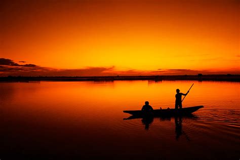 Silhouette Of Men Fishing During Sunset HD Wallpaper Wallpaper Flare