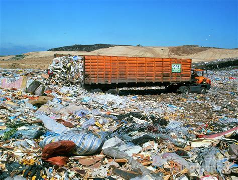 Landfill Site With Waste Truck Dumping Refuse Photograph By Maximilian