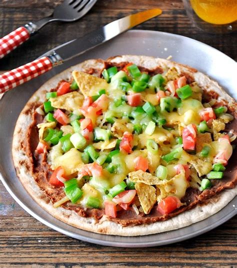 Mexican pizza 12'' = $20.49 16''= $26.49 20''= $32.49 taco meat, tomatoes, green onions, black olives, jalapenos, cheddar & mozzarella cheese b.l.t. Nacho Pizza | Recipe (With images) | Recipes