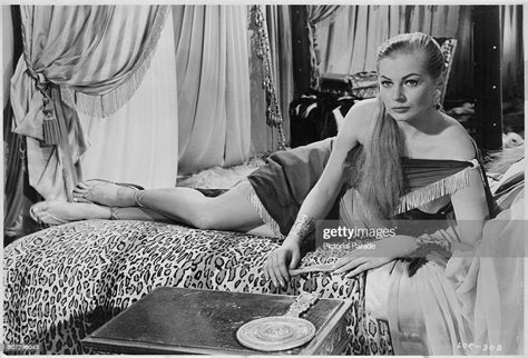 Actress Anita Ekberg Reclining On A Bed In A Scene From The Movie