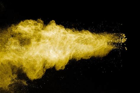 Abstract Yellow Powder Explosion On Black Backgroundfreeze Motion Of