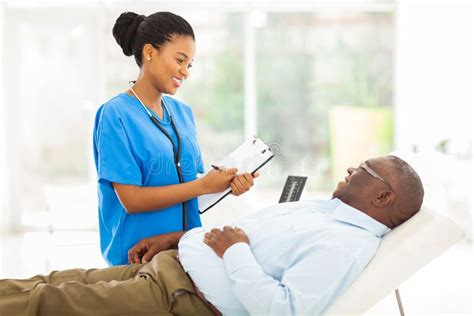 African Doctor Consulting Senior Patient Stock Photo Image Of