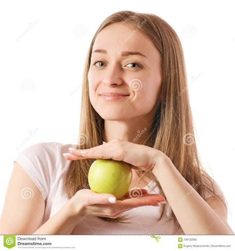 Beautiful Young Smiling Woman Holding An Apple In Her Hands Stock Image