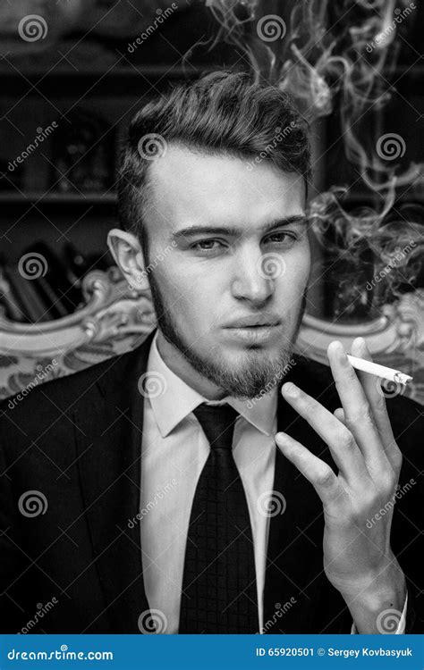 Man Sitting In Vintage Chair With A Cigarette Stock Image Image Of Expression Shoes 65920501