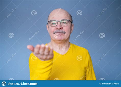Senior Man Showing Something On His Palm Stock Photo Image Of Smile