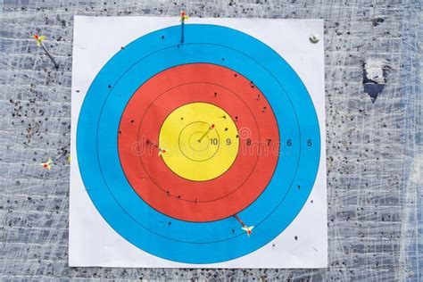 Closeup On Outdoor Archery Target Board With Arrow On Bullseye Stock