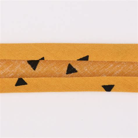 schrägband einfassband baumwolle bedruckt dreiecke ocker schwarz breite 2cm