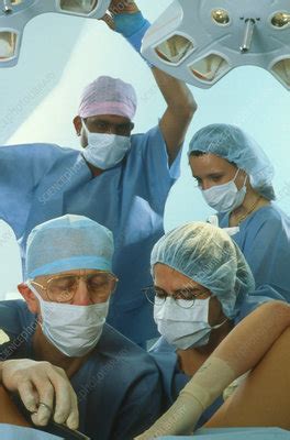 View Of Surgeons Conducting A Vaginal Operation Stock Image M