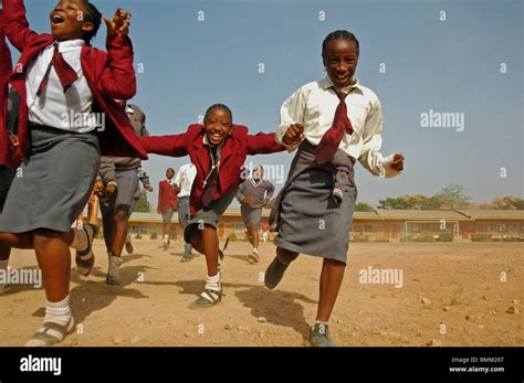 Nigeria Jos Schoolboys And Schoolgirls In Their Purple And Blue
