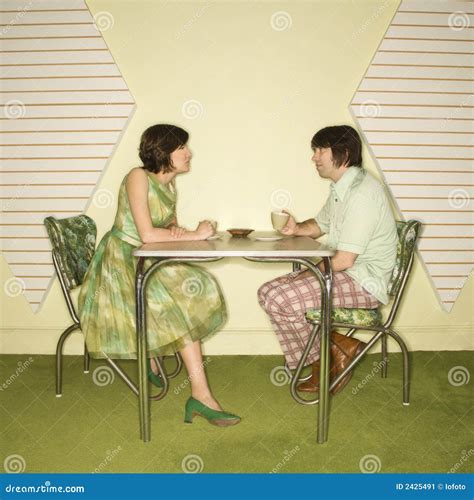 Couple Sitting At Table Stock Image Image Of 1970s Adult 2425491