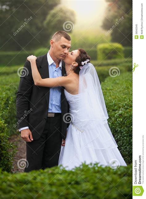 Bride Kissing Groom At Garden Stock Image Image Of Male Bush 39342345