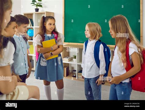 Group Of Shy Children Meet For The First Time In The Classroom On The