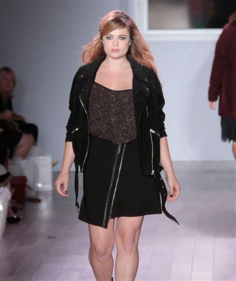 A plus-size model walks the runway as she models clothing from the ...