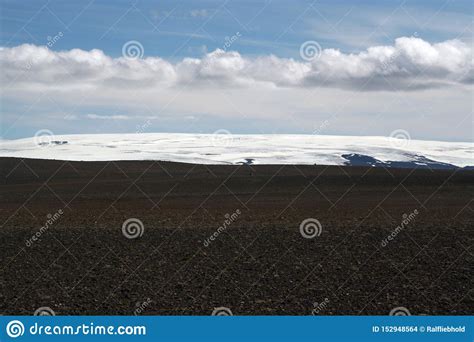 View Over Black Wide Endless Black Barren Wasteland With Snow Capped