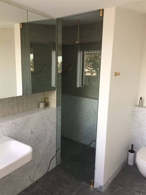 Sliding glass shower doors are perceived as a classy addition to any bathroom and will increase the value of a home if they are installed. Floor To Ceiling Shower Door | Pro Shower screens and ...