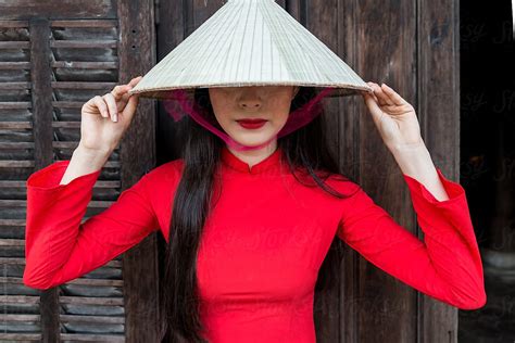 Vietnamese Women In Ao Dai Traditional Costume And Conical Hat By