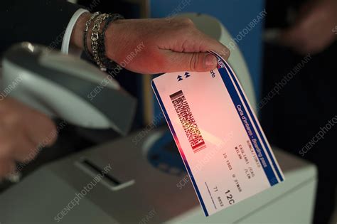 Person Holding Tickets At Airport Check In Area Stock Image F019