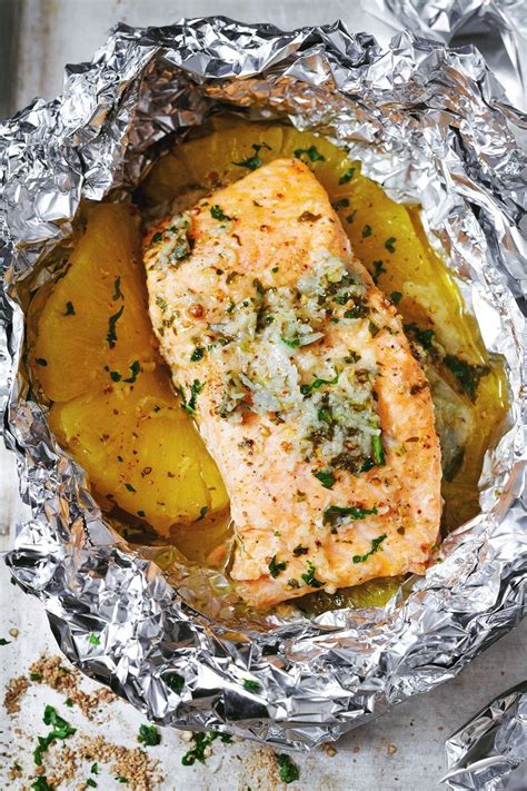 Baking it in its own foil packet makes it so juicy and tender, it falls apart on its own. Garlic Lemon Butter Salmon in Foil with Pineapple — Eatwell101