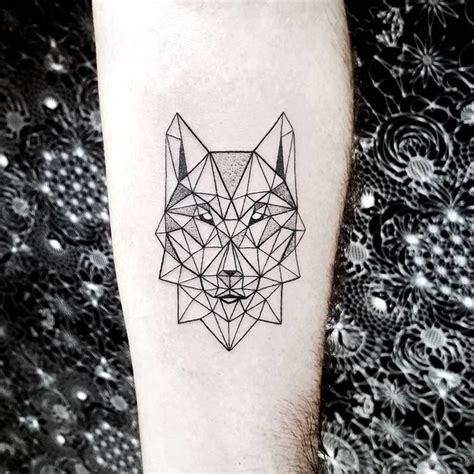 A Black And White Photo Of A Wolf Head On The Left Inner Forearm Tattoo