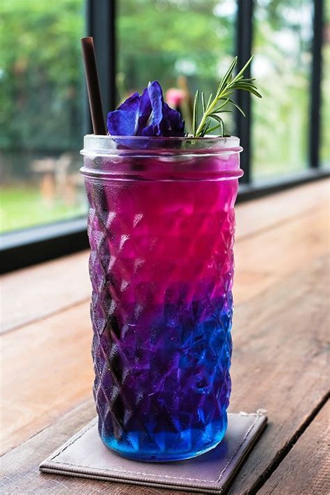 Grenadine “rains” Through The Ice And Combines With Blue Curaçao To Give You The Purple Gin