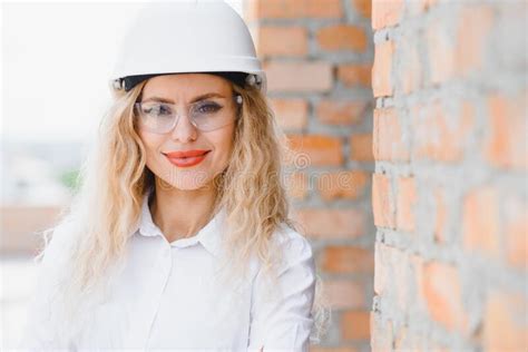 Female Construction Engineer Architect With A Tablet Computer At A