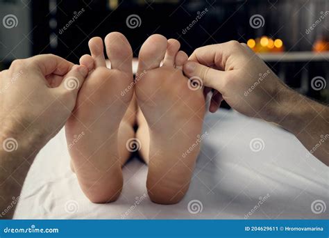 Male Hands Of A Massage Therapist Does A Woman Foot Massage Stock Image Image Of Lifestyle