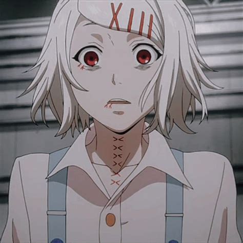 an anime character with white hair and red eyes looks at the camera while wearing suspenders