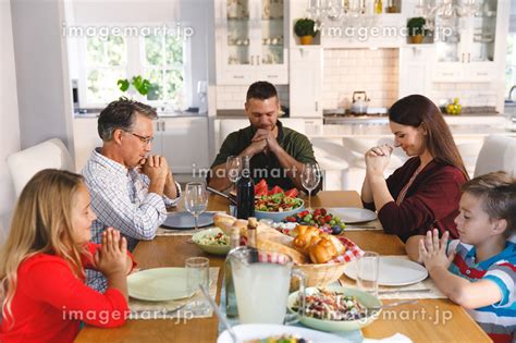 Caucasian Grandfather And Parents With Son And Daughter Sitting At