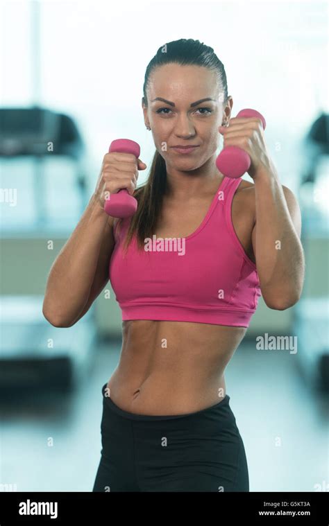 Muscular Boxer Woman Mma Fighter Practice Her Skills With Dumbbells In