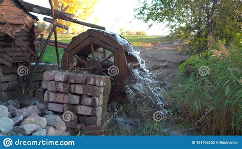 Old Wooden Water Mill With Rotating Wheel Stock Photo Image Of